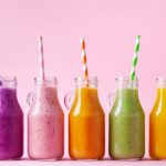 Summer,Colorful,Fruit,Smoothies,In,Jars,On,Pink,Background.,Healthy,